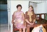 Fortuna Malca with a guest, in shul at the Bar-Mitzvah of one of her sons